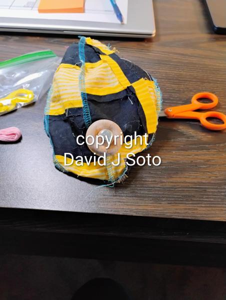 RABBIT B made with yellow and black material sewn together. Ears and tail made from Minky fabric. Wood joints installed for posing only. This is not a toy for children.